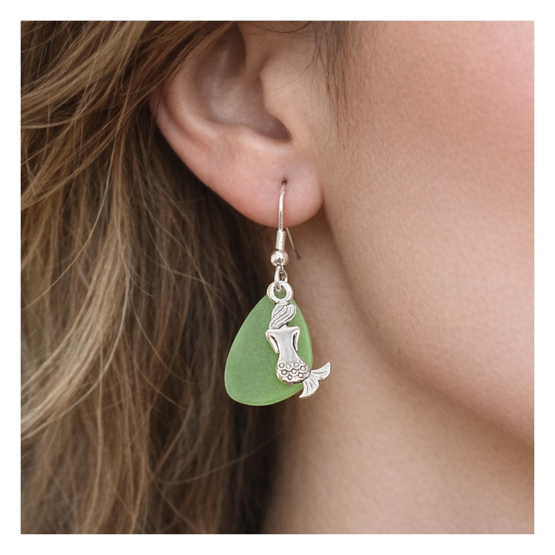 Handmade dainty mermaid charm and green tumbled sea glass bead earrings, coastal beach jewelry gift for her