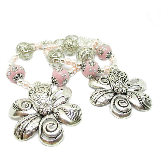 Handmade pink crystal and pearl flower curtain tiebacks with silver floral focal pendant and white pearl center, set of 2