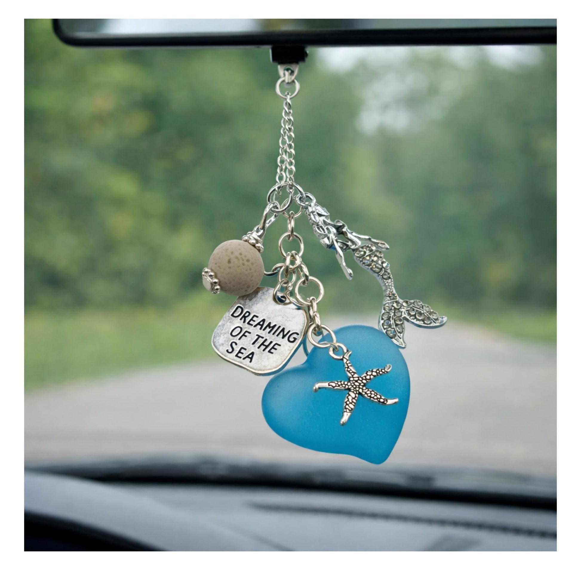 Mermaid rearview mirror charm shown hanging from a car mirror — handmade coastal car accessory