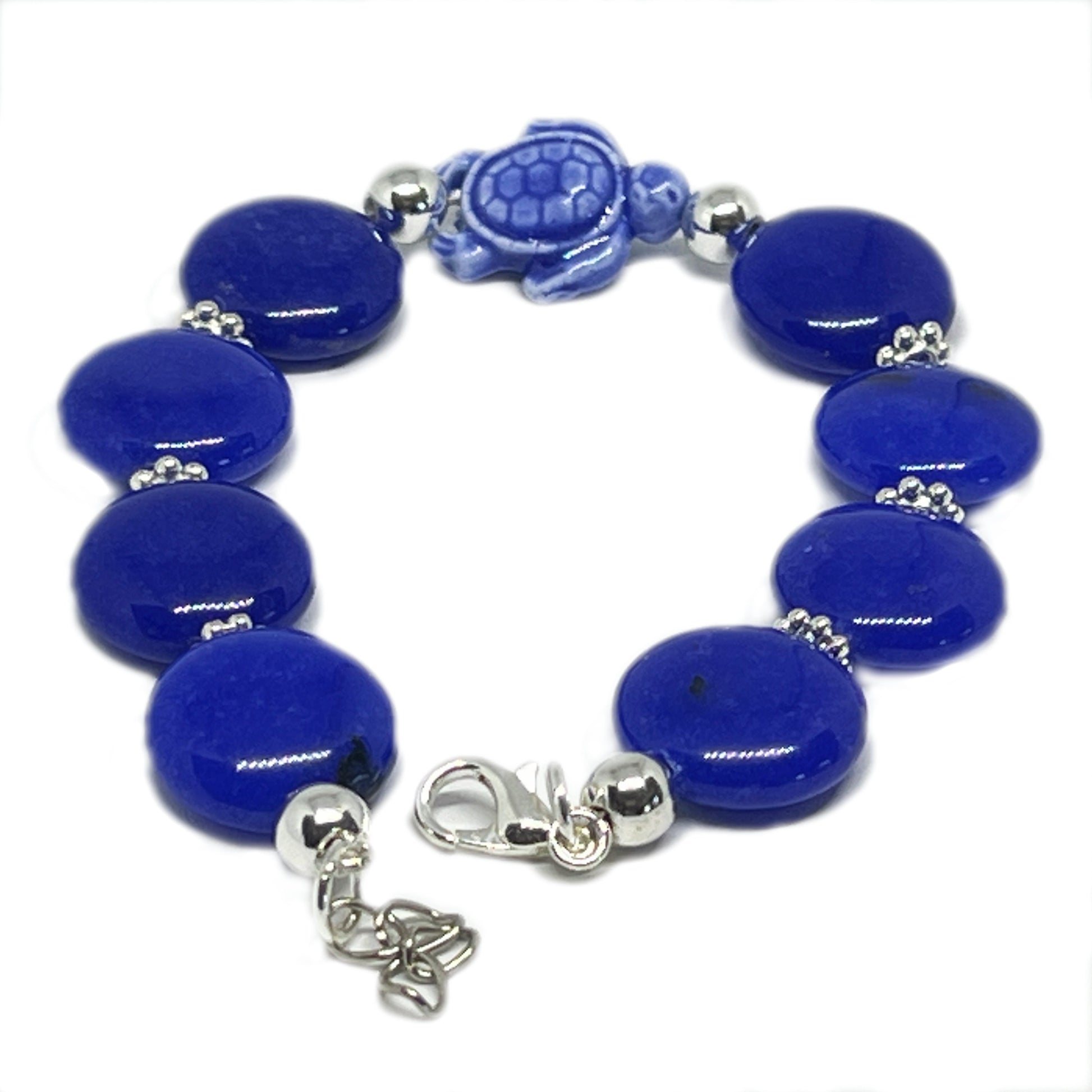 Lapis lazuli sea turtle stone charm bracelet shown on a wrist — ocean inspired handmade jewelry