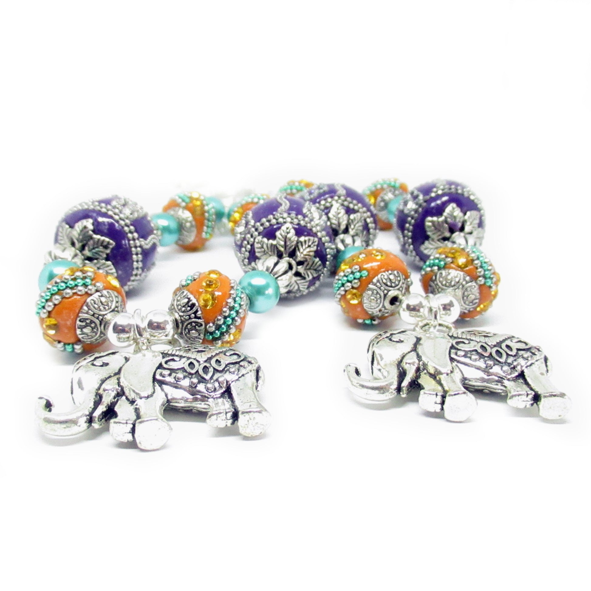 Handmade 3D elephant curtain tiebacks with ornate Indonesian beads, sparkling crystals and purple stone accents, set of 2