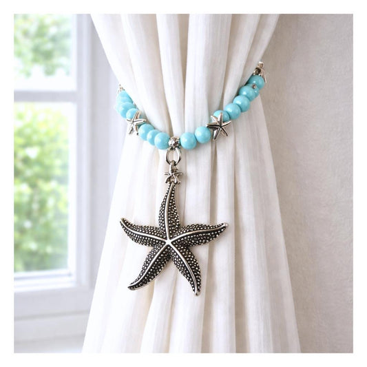 Set of two beaded starfish curtain tiebacks shown styled on sheer curtains — handmade coastal beach home decor