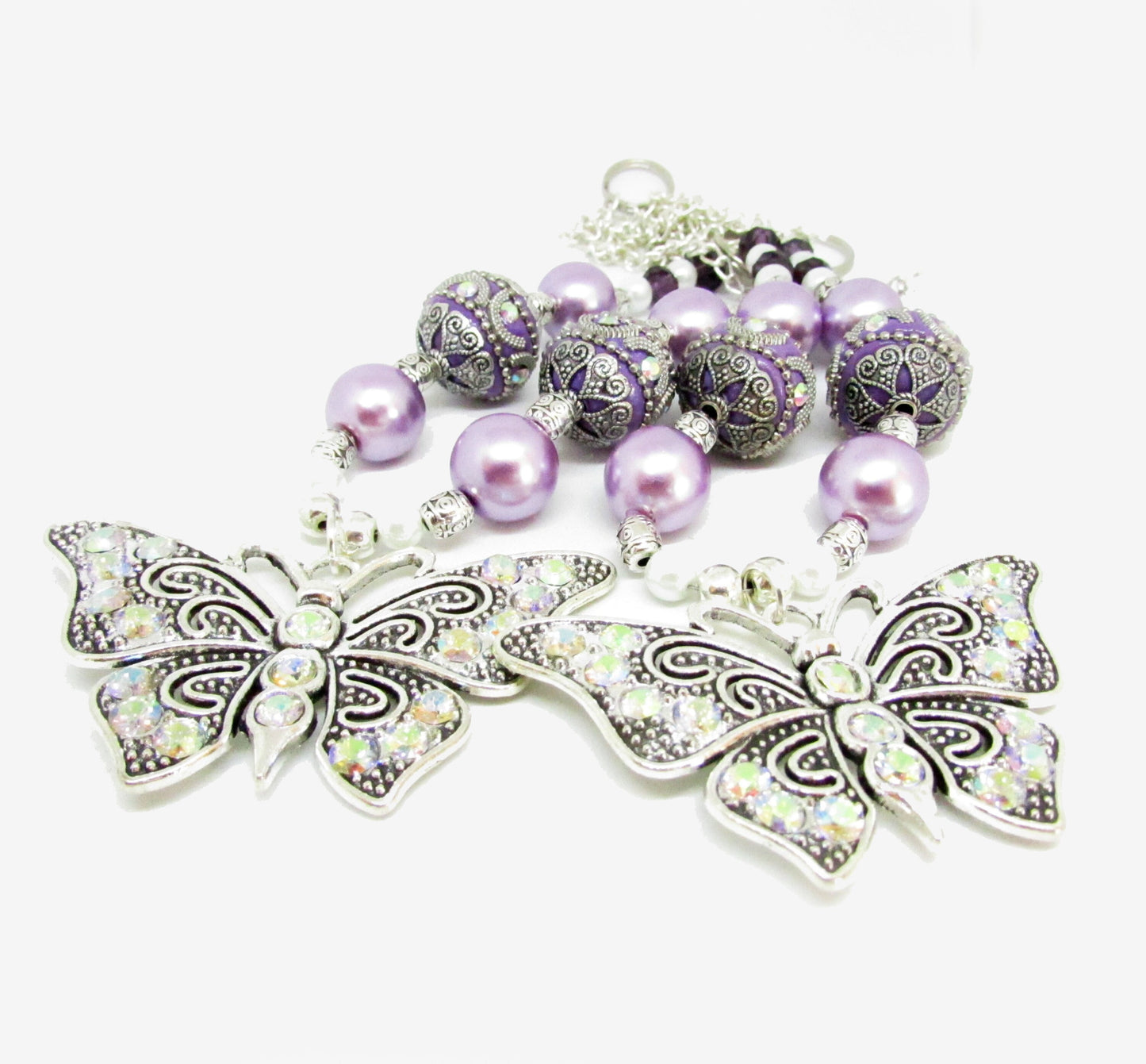 Large sparkly rhinestone butterfly pendant on beaded curtain tieback strand, available in pink purple yellow white and blue