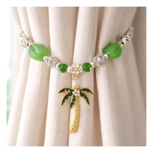 Palm tree sea glass and shell curtain tiebacks shown styled on sheer curtains — handmade beach cottage home decor