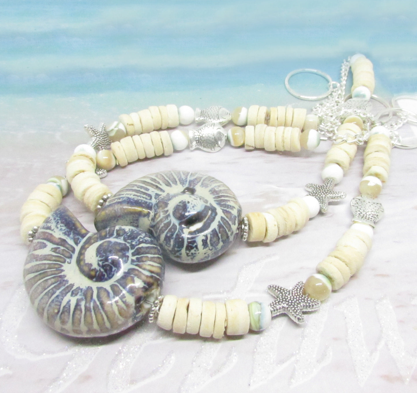 Handmade seashell curtain tiebacks with large ceramic shell focal bead, coconut shells and silver starfish accents, set of 2