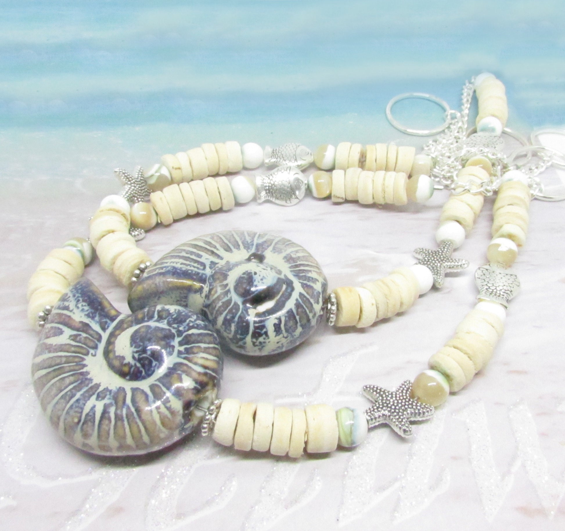 Handmade seashell curtain tiebacks with large ceramic shell focal bead, coconut shells and silver starfish accents, set of 2