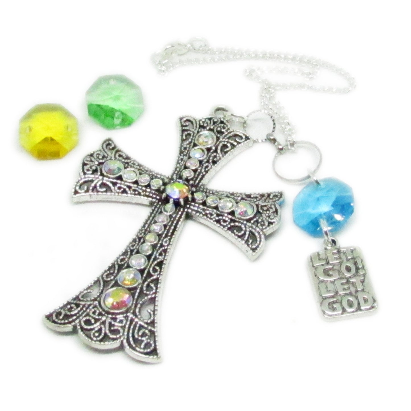 Rhinestone cross rearview mirror charm shown hanging from a car mirror — handmade sparkly car accessory