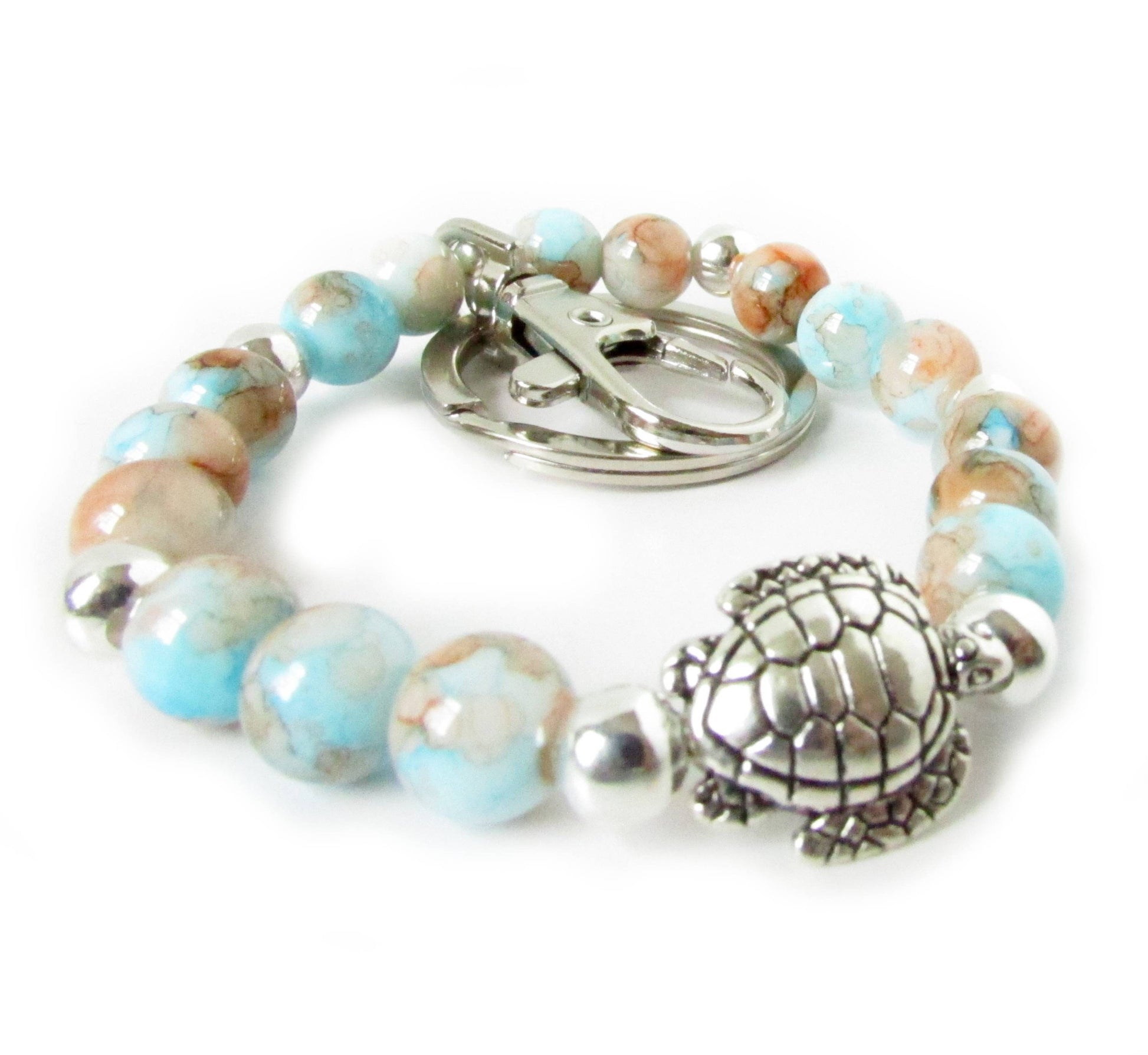 Handmade sea turtle keychain bracelet with mottled Atlantic seashore glass beads and silver turtle charm