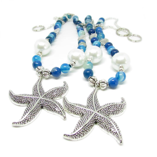 Handcrafted starfish curtain tiebacks with sea blue beads and shell accents, beach cottage decor