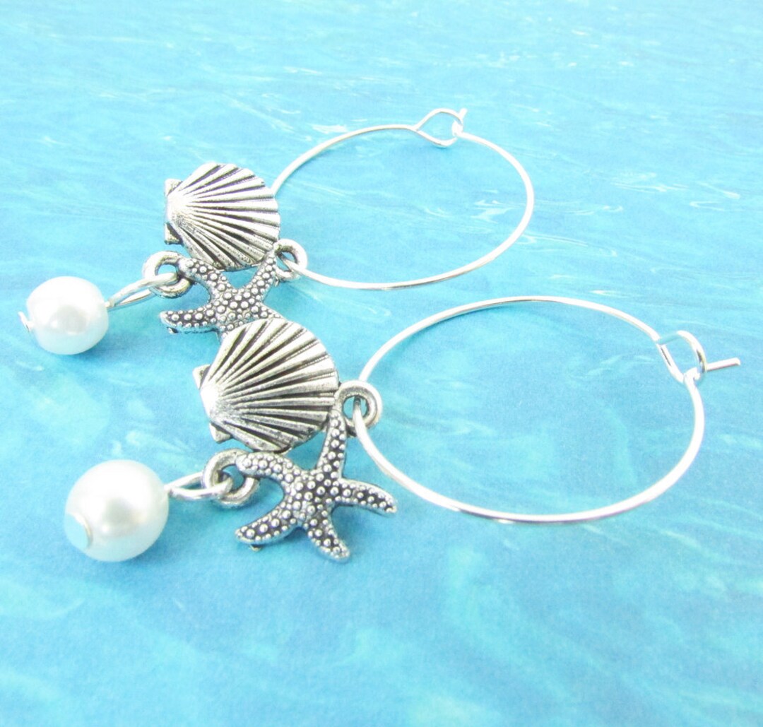Silver hoop earrings with pearl dangle and seashell and starfish charms
