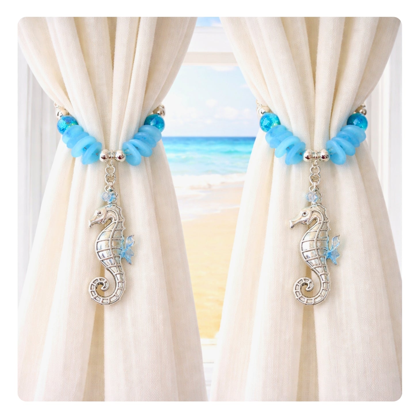 Seahorse and sea glass curtain tieback shown styled on sheer curtains — handmade coastal beach house drapery holdback