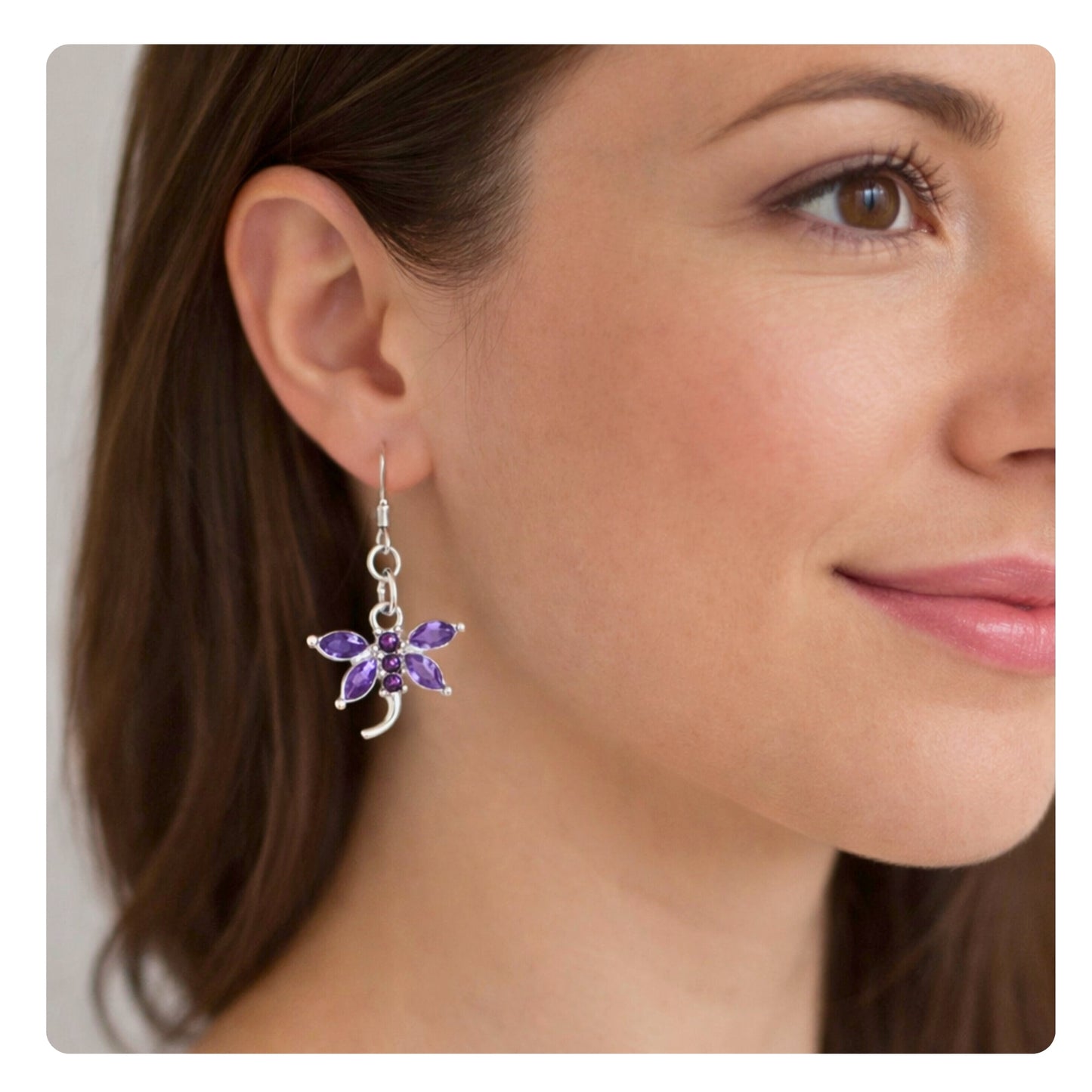 Pink and purple crystal dragonfly dangle earrings shown on a model — handmade boho beach jewelry
