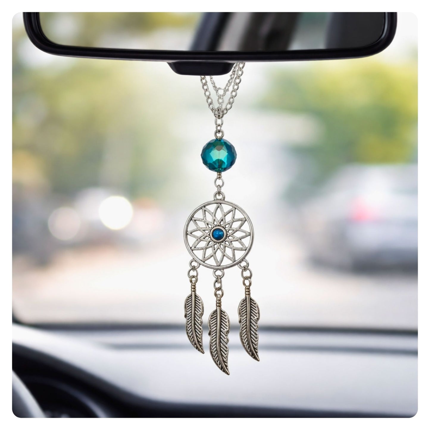 Dream catcher rearview mirror charm shown hanging from a car mirror — handmade boho car accessory