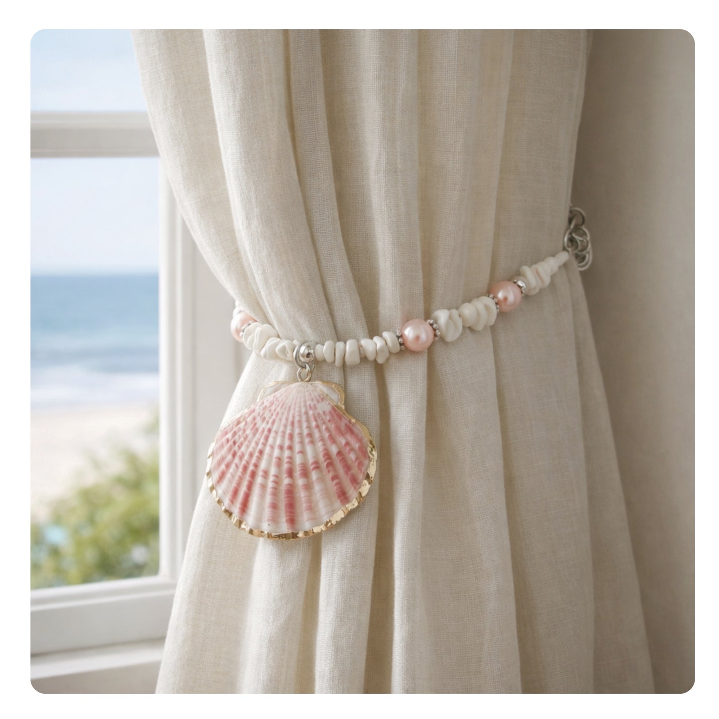 Set of two pink shell beaded curtain tiebacks shown styled on sheer curtains — handmade coastal beach window ornaments