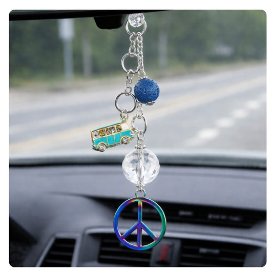 Retro peace sign car charm shown hanging from a rearview mirror — handmade boho car accessory