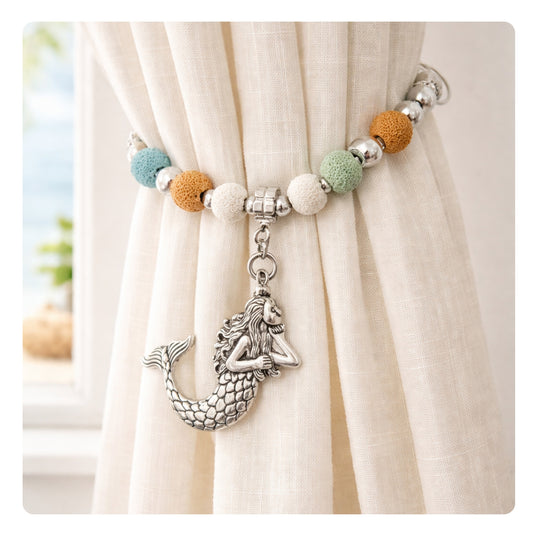 Set of two mermaid curtain tiebacks with lava beads shown styled on sheer curtains — handmade coastal beach home decor