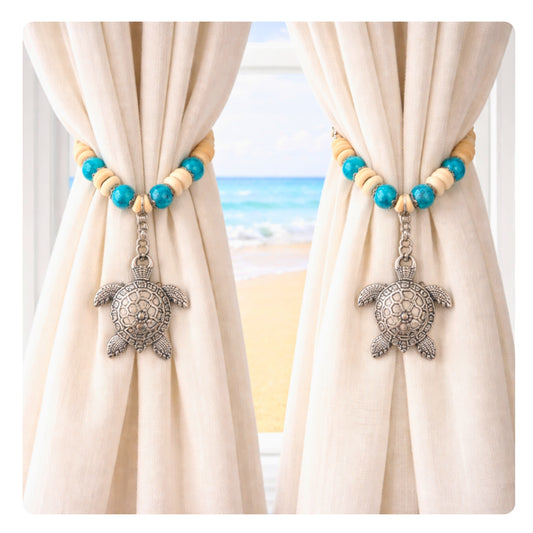 Set of two sea turtle curtain tiebacks shown styled on sheer curtains — handmade nautical beach house home decor